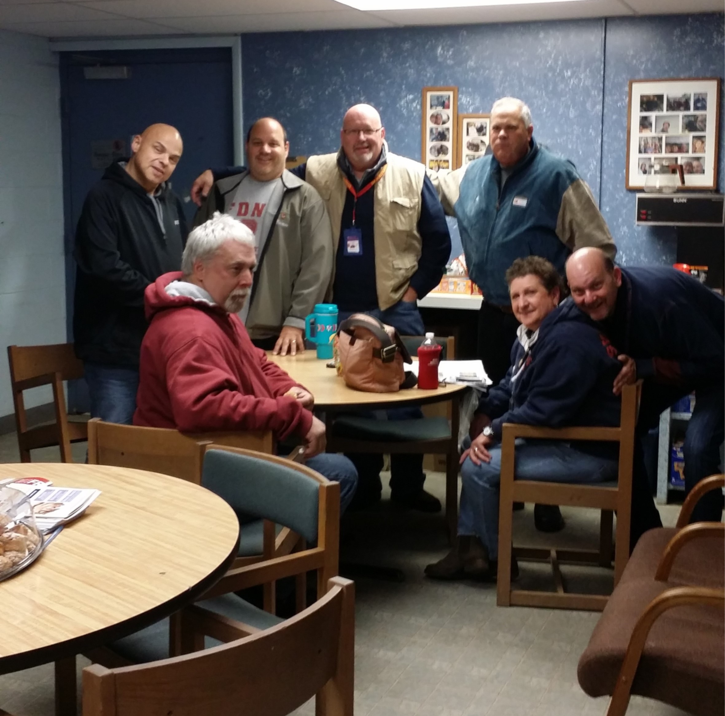 photograph of bus drivers smiling