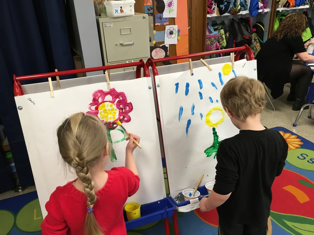 two students painting