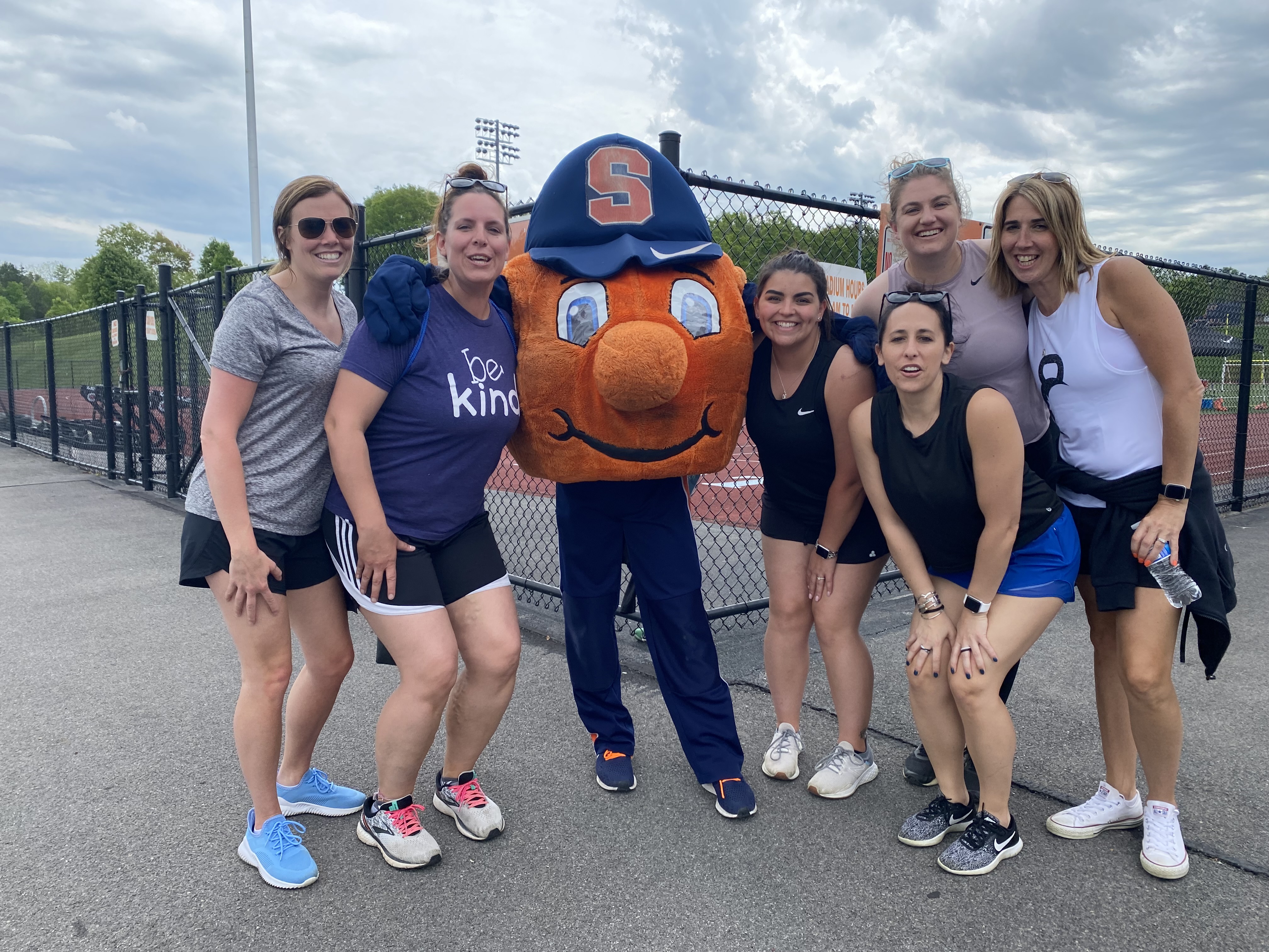 Teachers pose with Otto, the Syracuse Orange mascot.