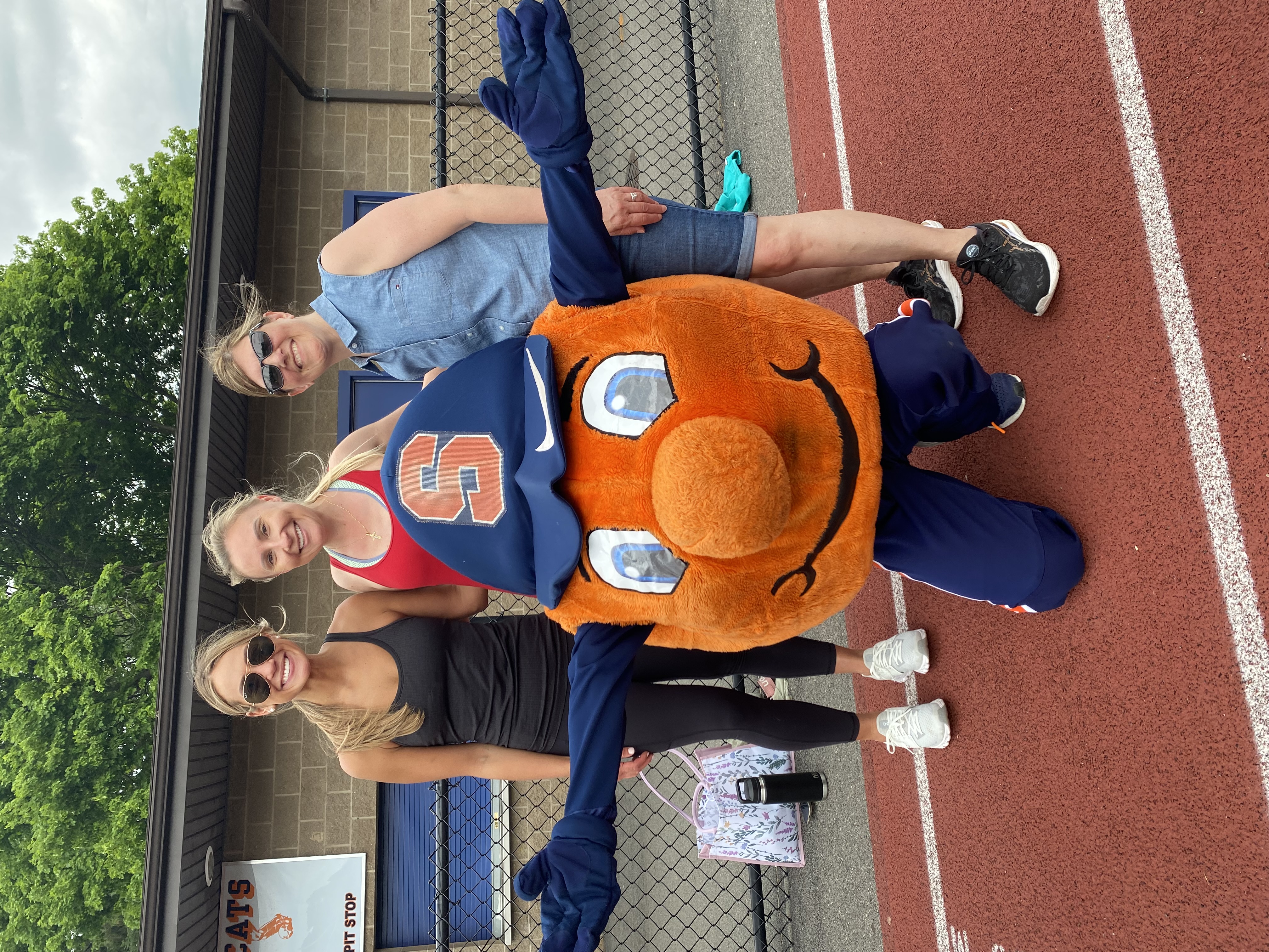 Teachers pose with Otto, the Syracuse Orange mascot.