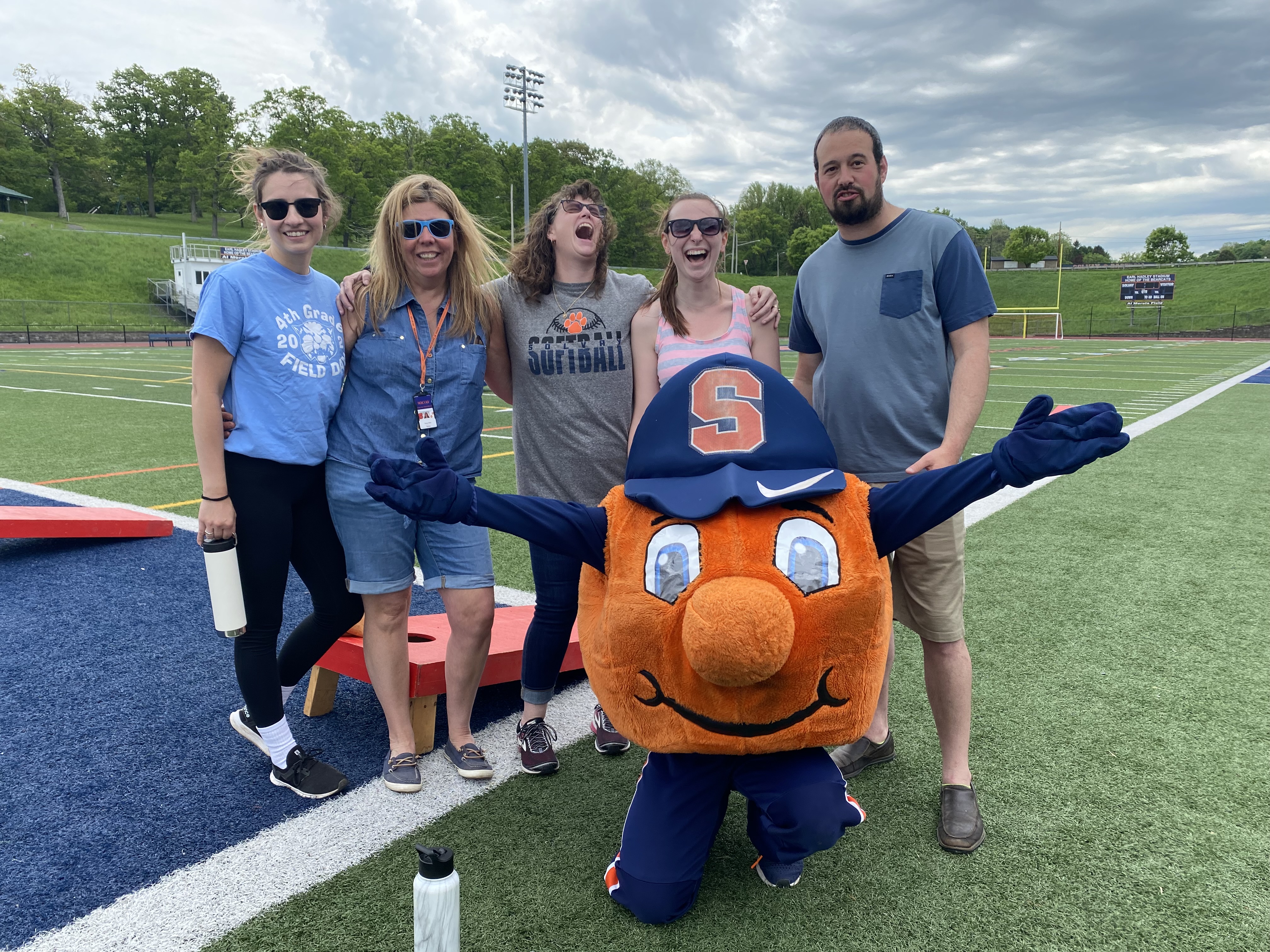 Teachers pose with Otto, the Syracuse Orange mascot.