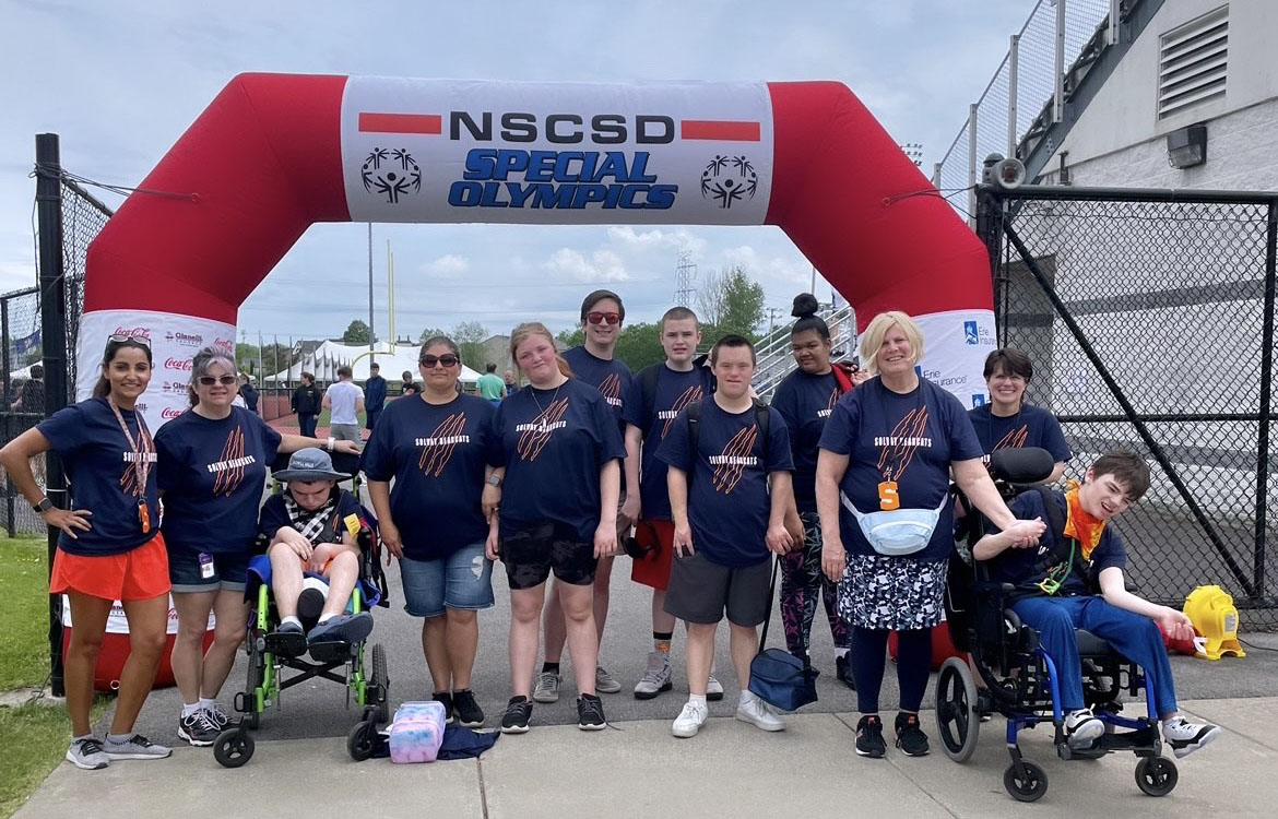 special olympics students pose for picture