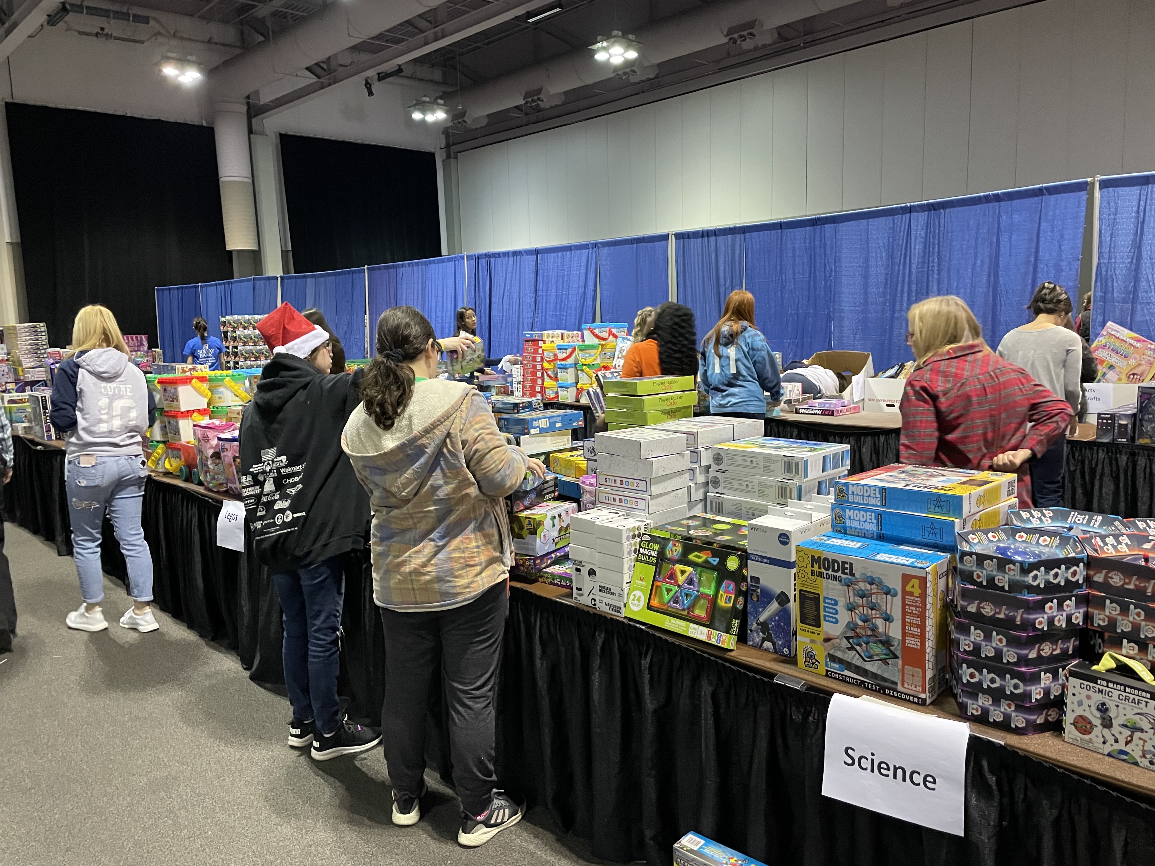 Students at Christmas bureau in Syracuse oncenter