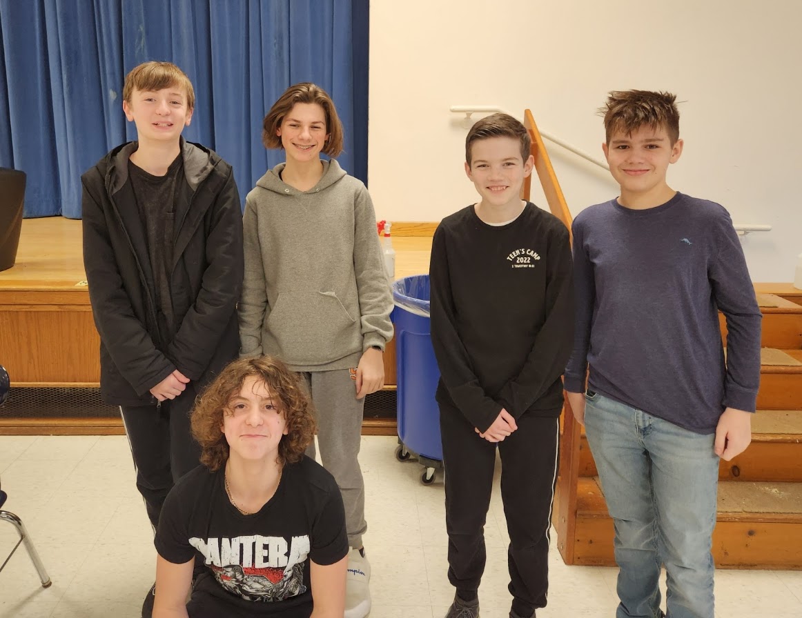 Five students pose for a picture