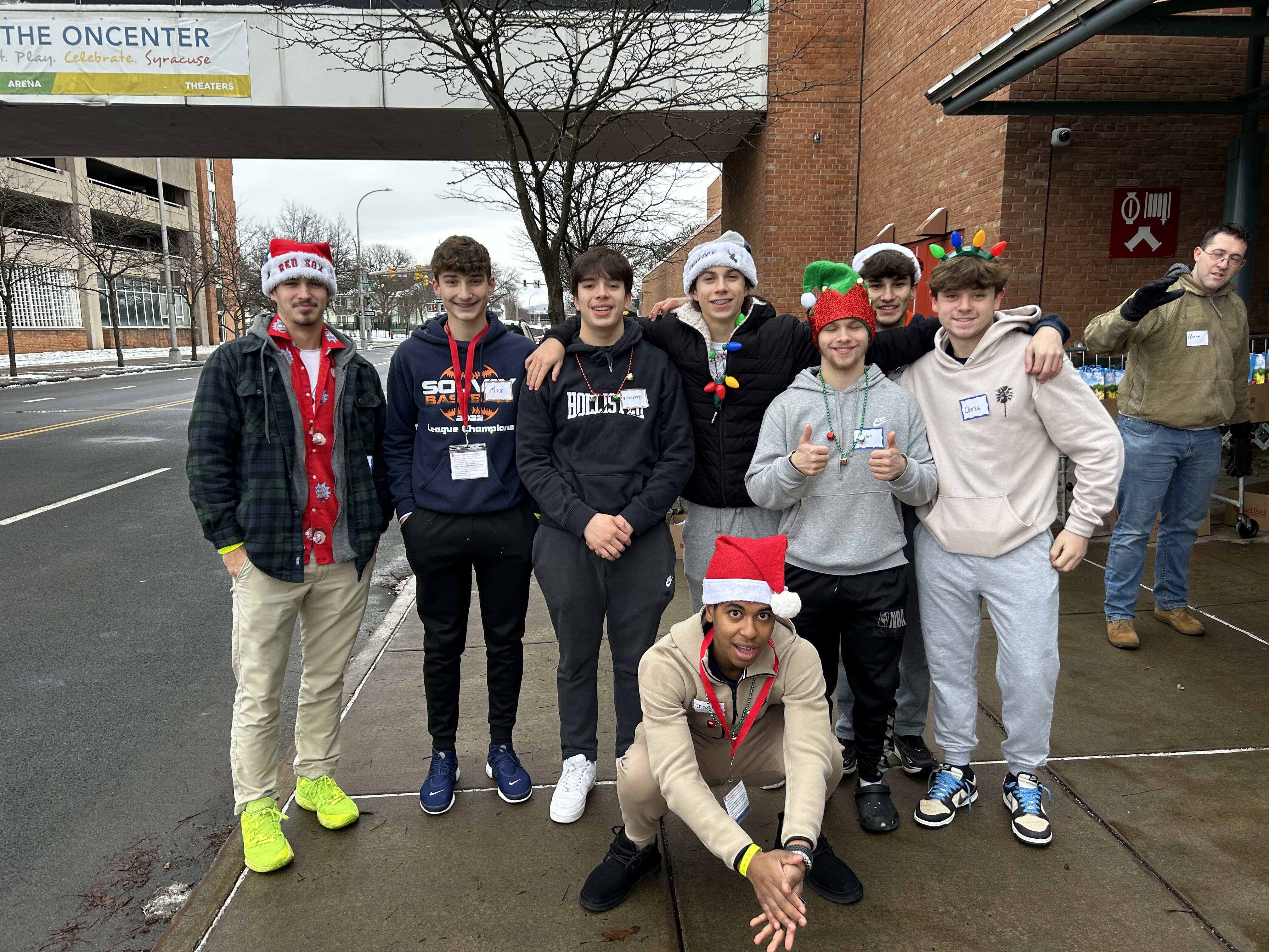 Students pose on sidewalk