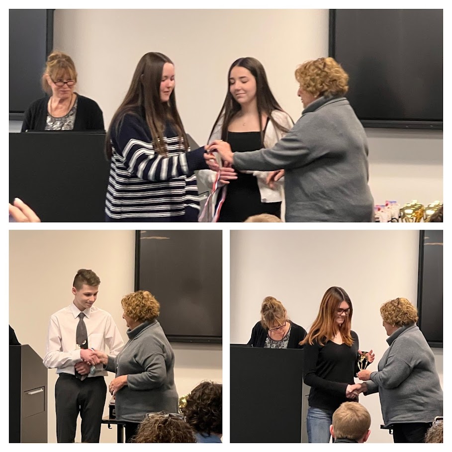 students receiving awards at history day event