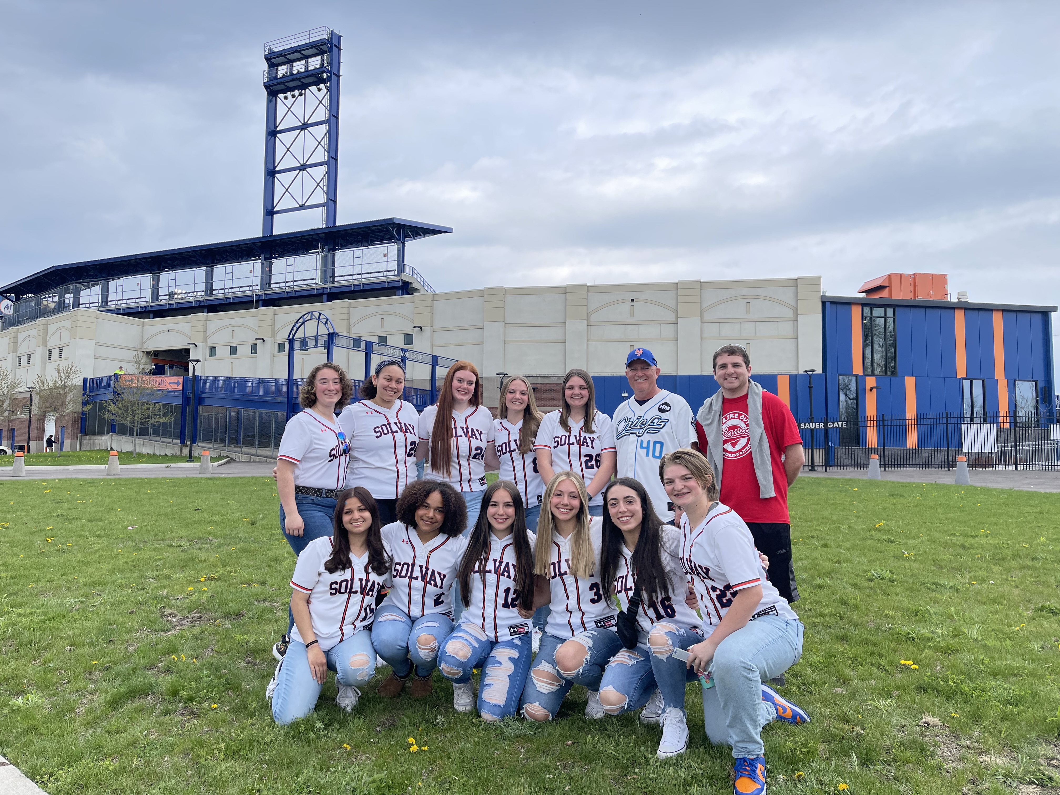 girls varsity softball team poses for pic