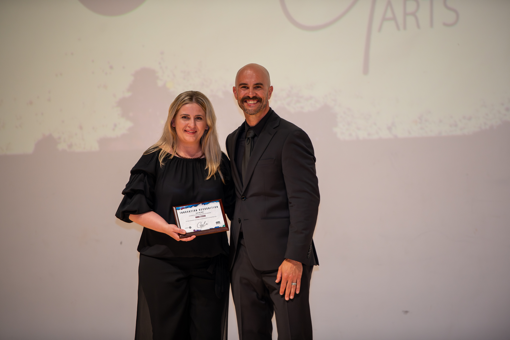 teacher receives plaque/award
