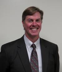Picture of Superintendent Jay Tinklepaugh dressed in suit and red tie.