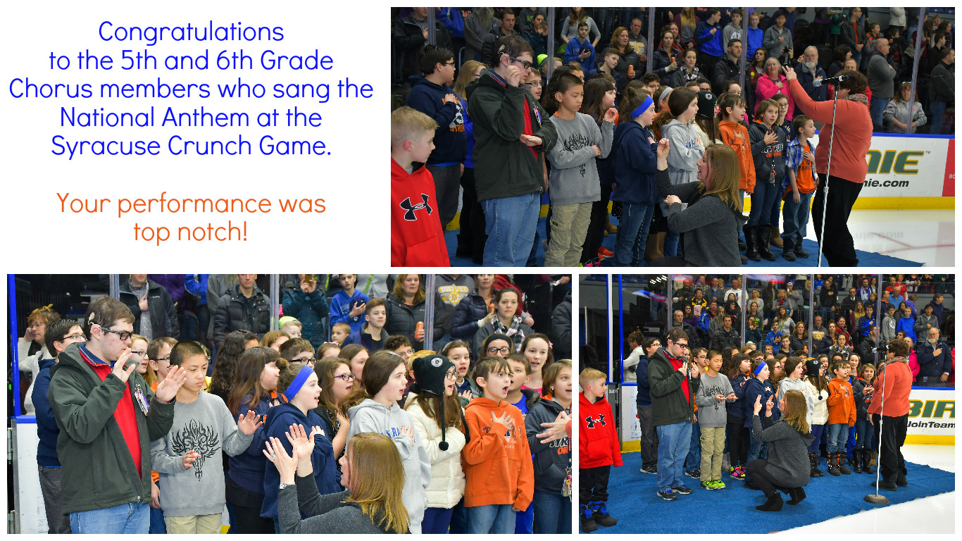Students sing at hockey game for Crunch Syracuse.