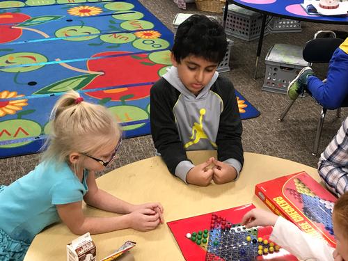 Kids playing boardgames