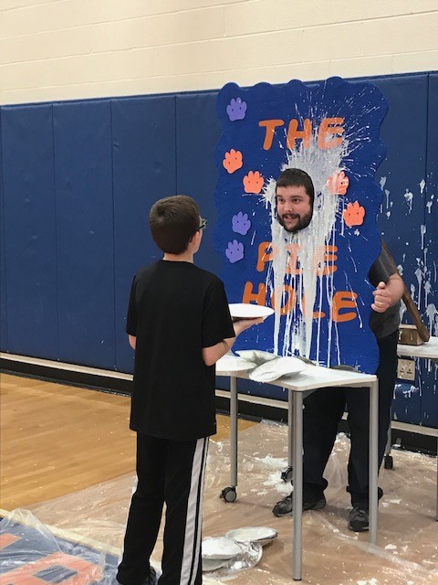 defiant teacher about to take a pie to the face