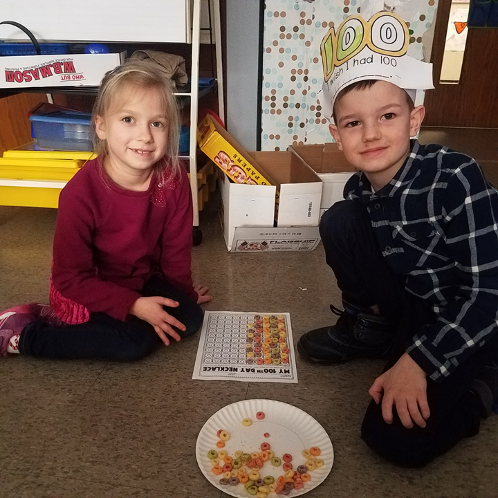 students pose on 100th day of school